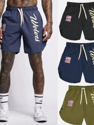 Navy active drawstring shorts with Wolves script logo and flag patch.