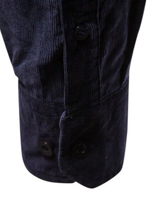 Indigo corduroy utility shirt with button cuffs and placket detail.
