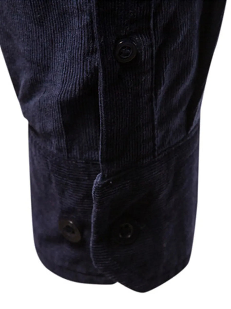 Indigo corduroy utility shirt with button cuffs and placket detail.
