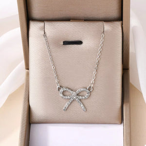 Silver bowknot pendant necklace with clear crystals, 18k gold-plated chain