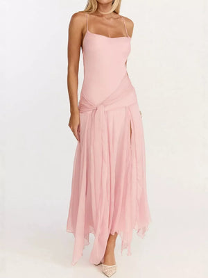 Elegant pink maxi dress with a high leg slit, spaghetti straps, and a tie waist detail.