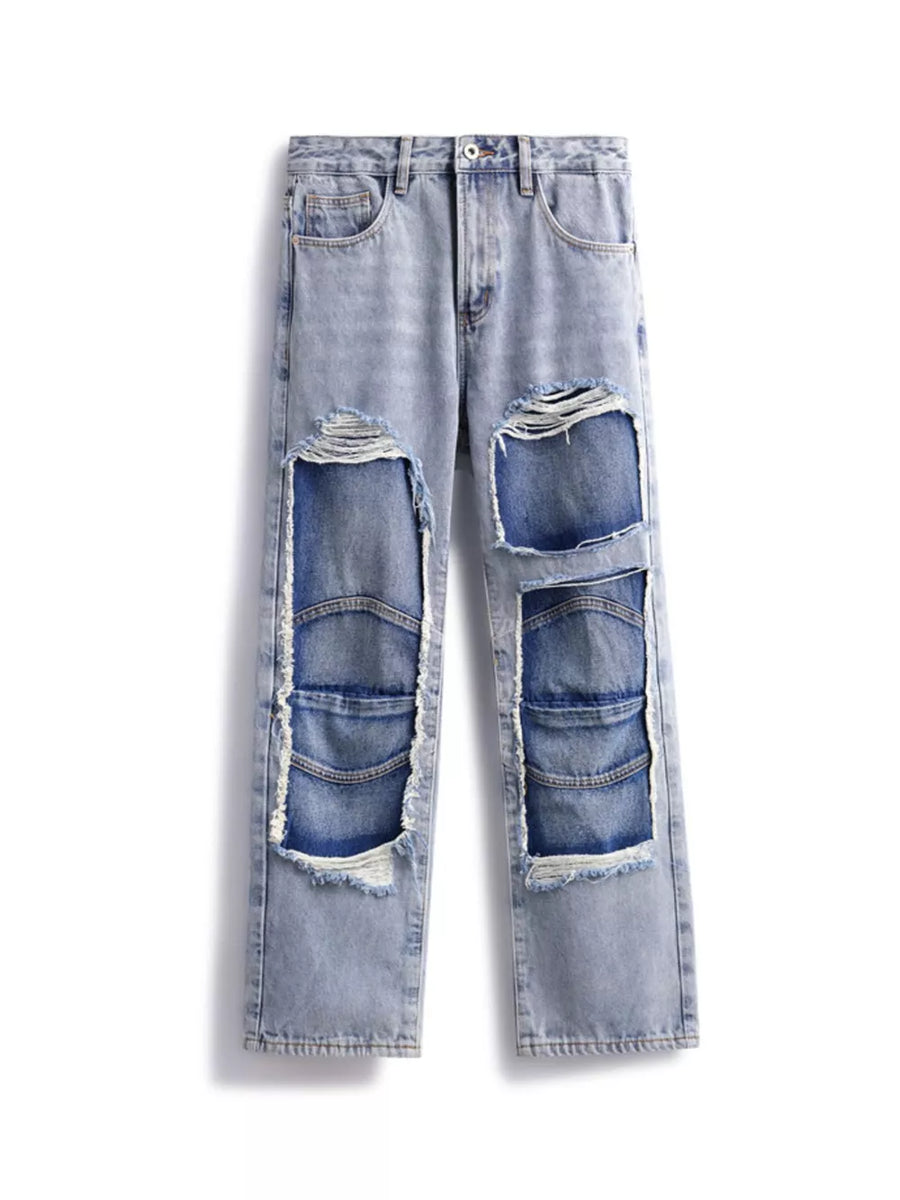 Men's light wash cotton jeans with distressed patchwork details and frayed edges.