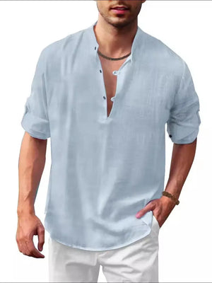 Light blue half-button full sleeve shirt with rolled cuffs and a band collar.