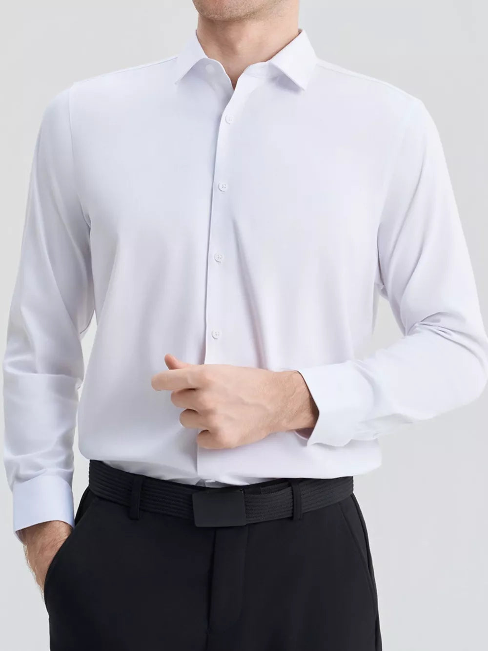 Men's slim fit long sleeve white button-down shirt with a spread collar.