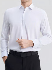 Men's slim fit long sleeve white button-down shirt with a spread collar.