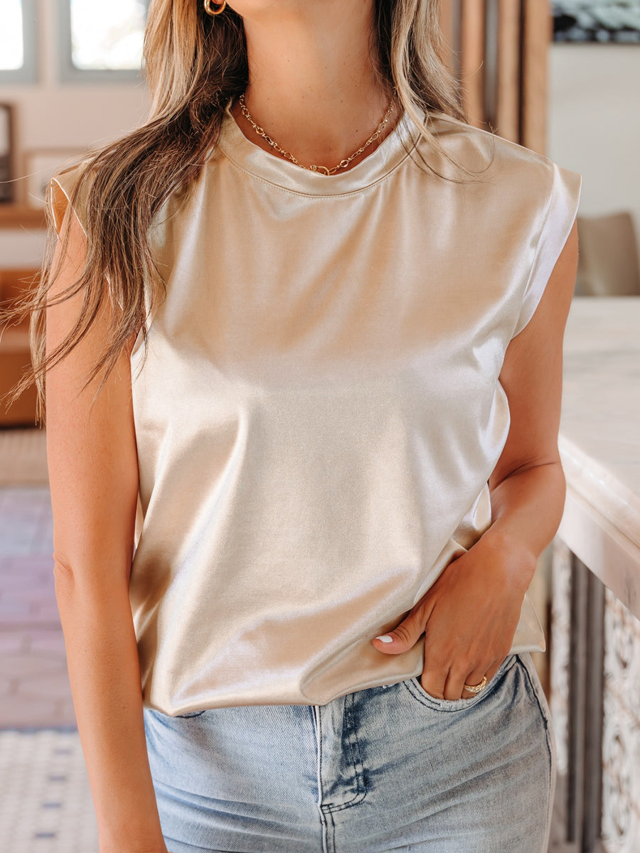 Champagne satin sleeveless tank top with shoulder pads and crew neck.