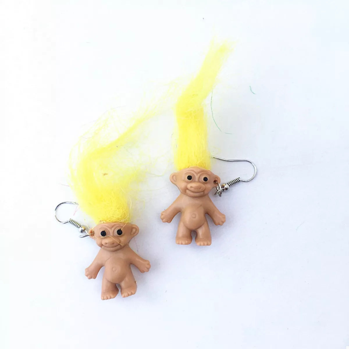 Yellow troll doll dangle earrings with fuzzy hair