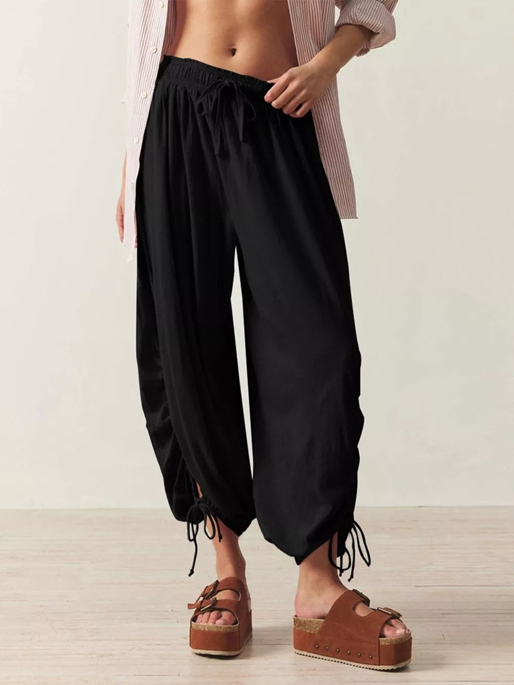 100% polyester Care instructions: Machine wash cold harem pants in Apricot with loose silhouette
