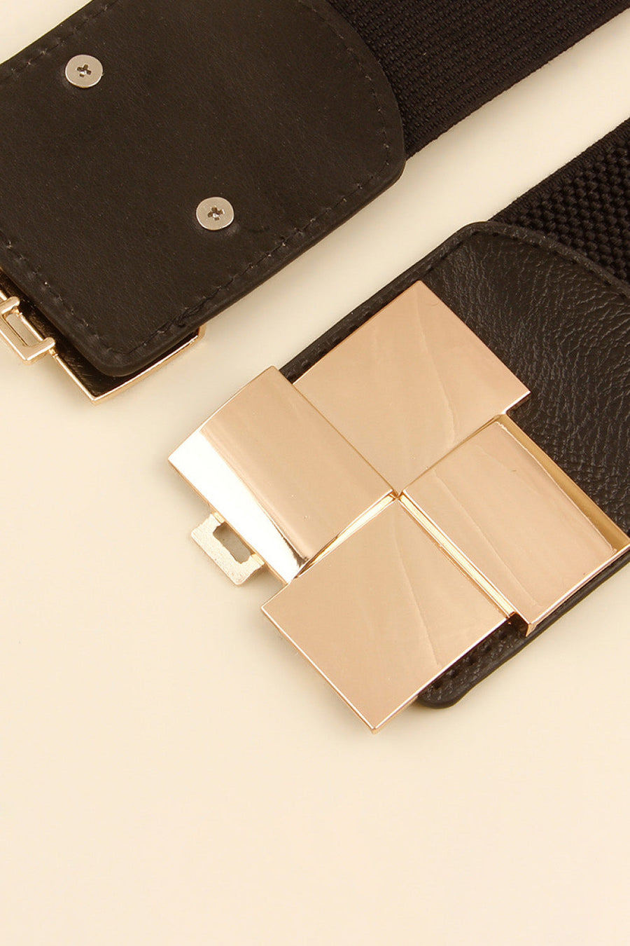 Black stretch belt with geometric rose gold buckle detail