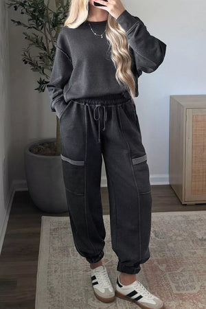 50% polyester, 50% cotton Care instructions: Machine wash cold lounge set in charcoal with relaxed silhouette