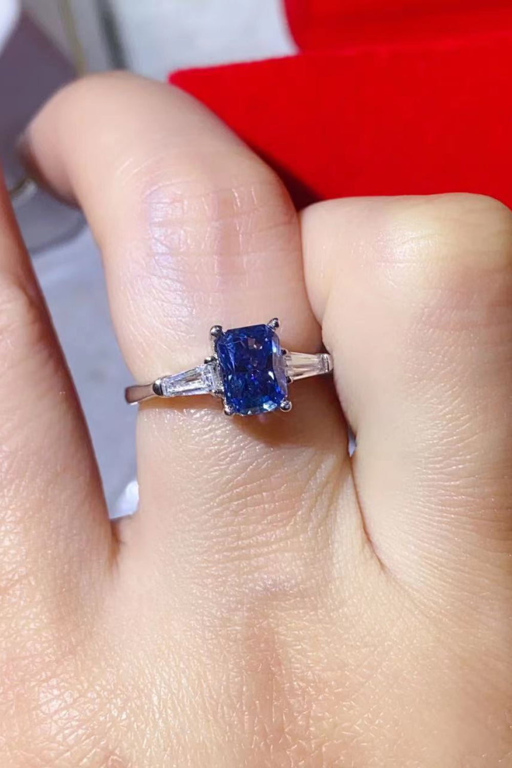 Blue moissanite ring in 925 sterling silver with baguette side stones