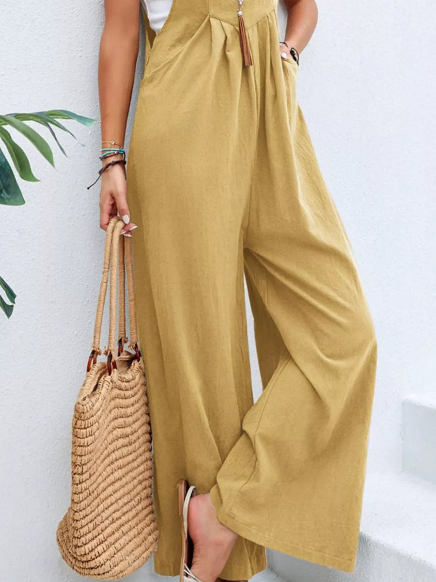 Light Yellow wide-leg romper with pockets and adjustable drawstring detail.