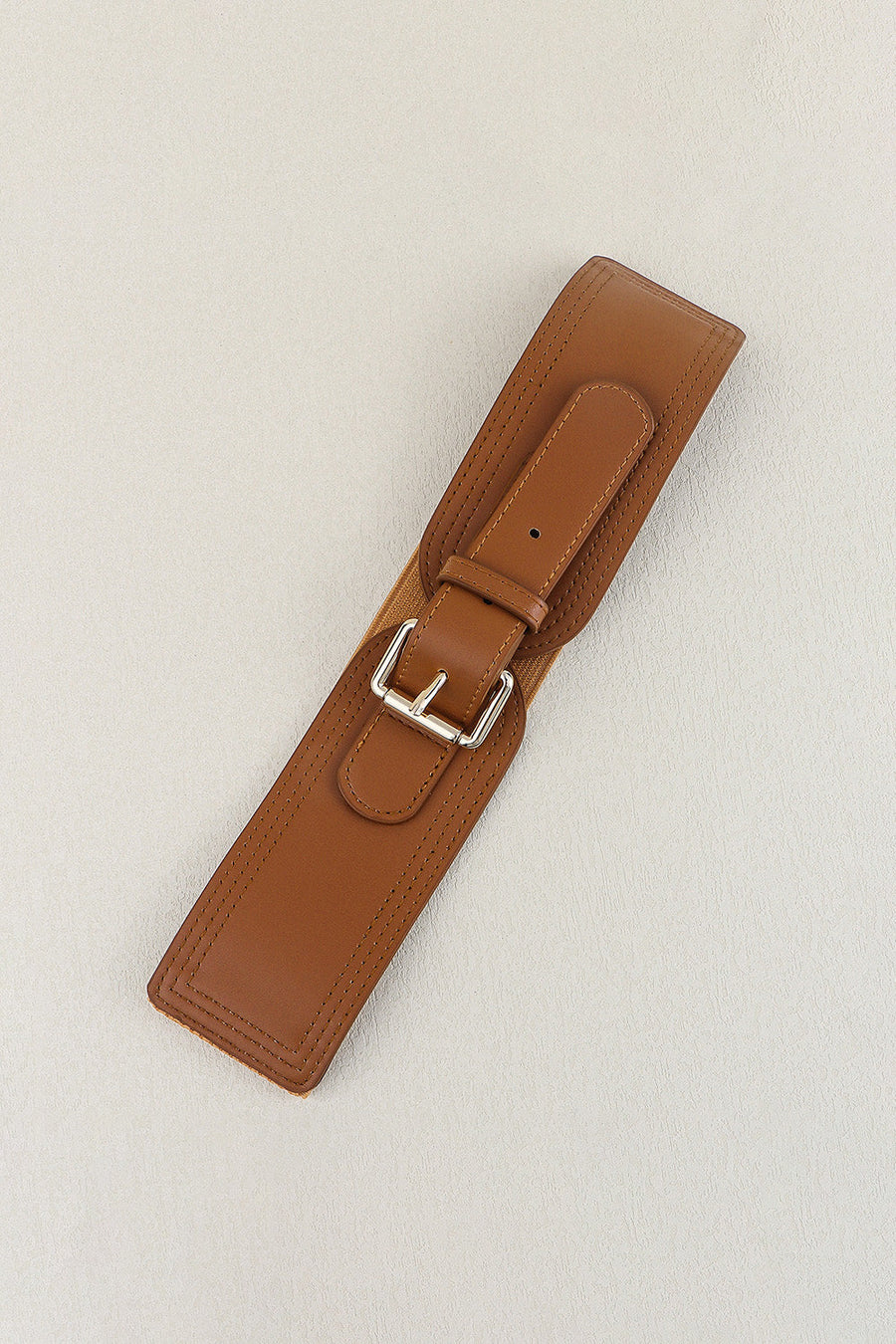 Caramel elasticated waist belt with silver buckle and faux leather trim
