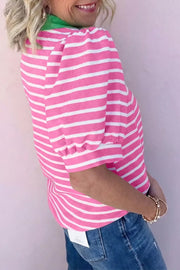 Pink and white striped cotton polo shirt with puff sleeves and green collar.