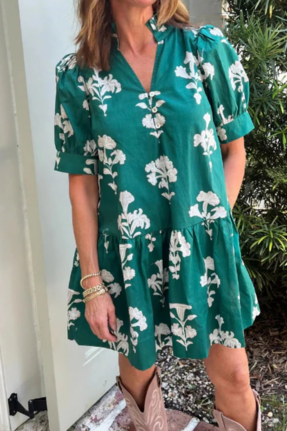 Green floral mini dress with puff sleeves and tiered skirt