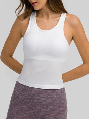 White ribbed racerback tank top with a fitted silhouette and scoop neckline.