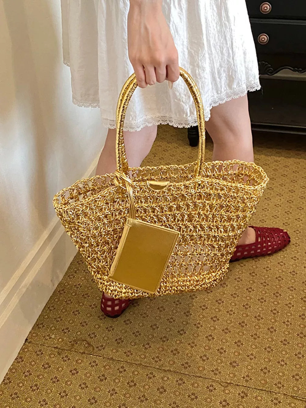 Gold tote featuring woven texture and woven