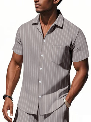 Men's grey striped camp collar shirt with button-down front and chest pocket.
