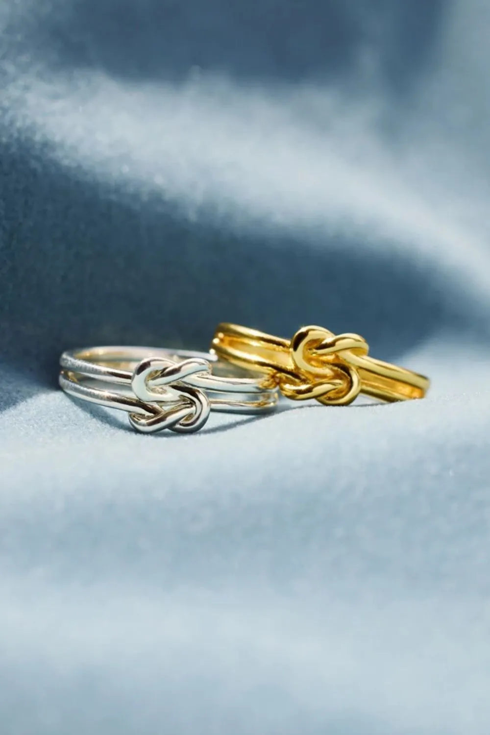 Double band knot rings in gold and silver metal.