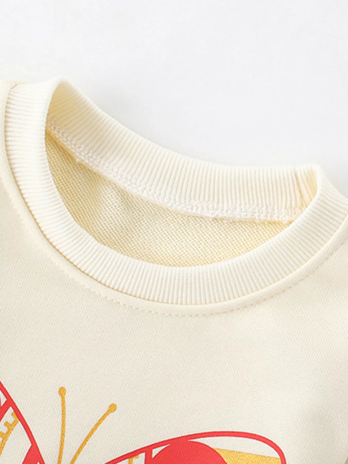 Cream crew neck sweatshirt with butterfly graphic detail
