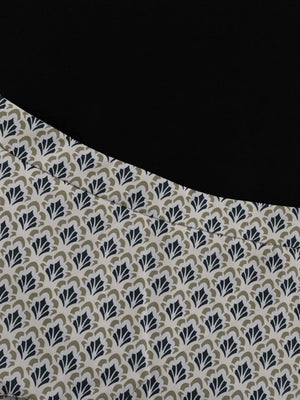 Black top with a cream fabric panel featuring a repeating navy and tan fan pattern.