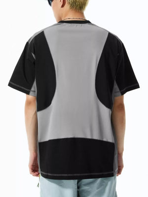 Relaxed fit t-shirt in black and grey with contrast stitching and a colorblock design.