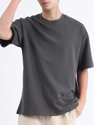 Men's dark gray cotton round neck t-shirt with short sleeves and a relaxed fit.