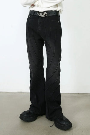 Dark denim flare trousers with chevron seam detailing and a casual fit.