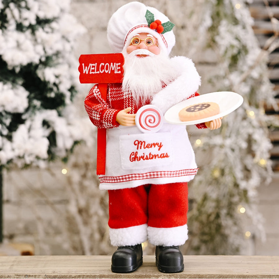 Festive Tartan Santa figurine in red with white trim, holding a welcome sign and a cookie.