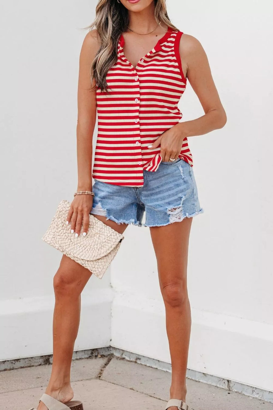 Red and cream striped ribbed knit tank top with button detail and collared neckline.