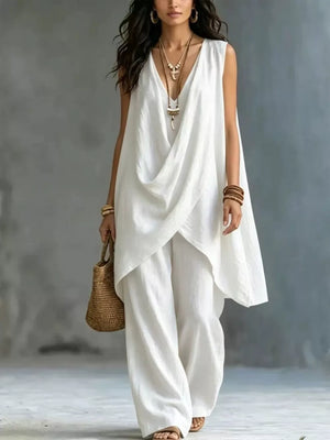 White asymmetrical tunic top and wide-leg pants set with draped neckline