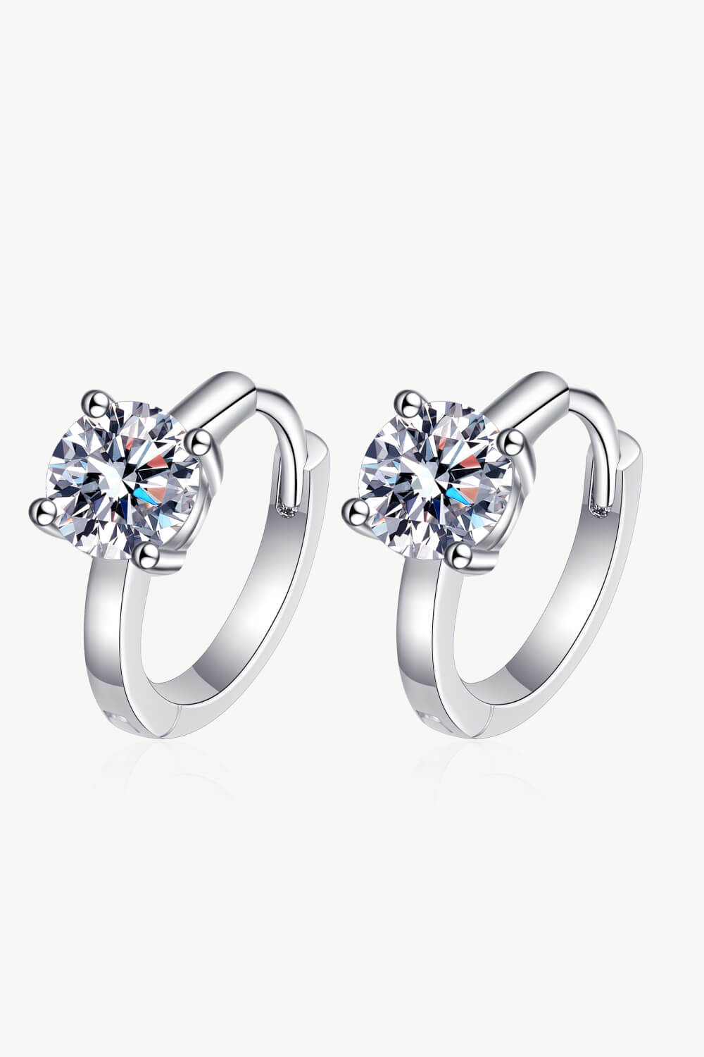 Silver hoop earrings with a solitaire diamond halo and a 925 silver band.