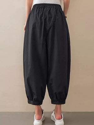 Black relaxed fit harem joggers with elastic waist and cuffed ankles.