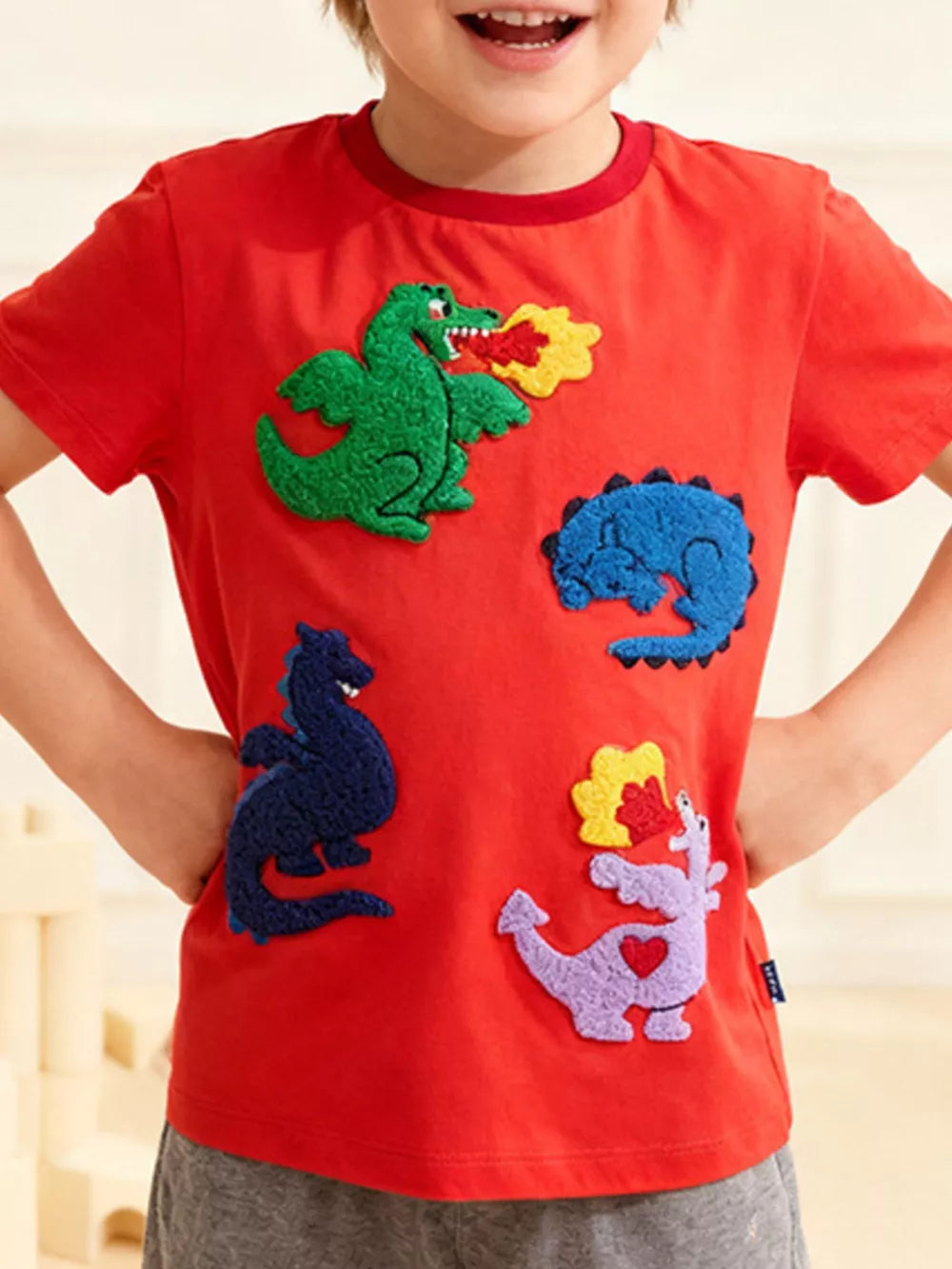 Red cotton t-shirt with dinosaur appliques for toddlers