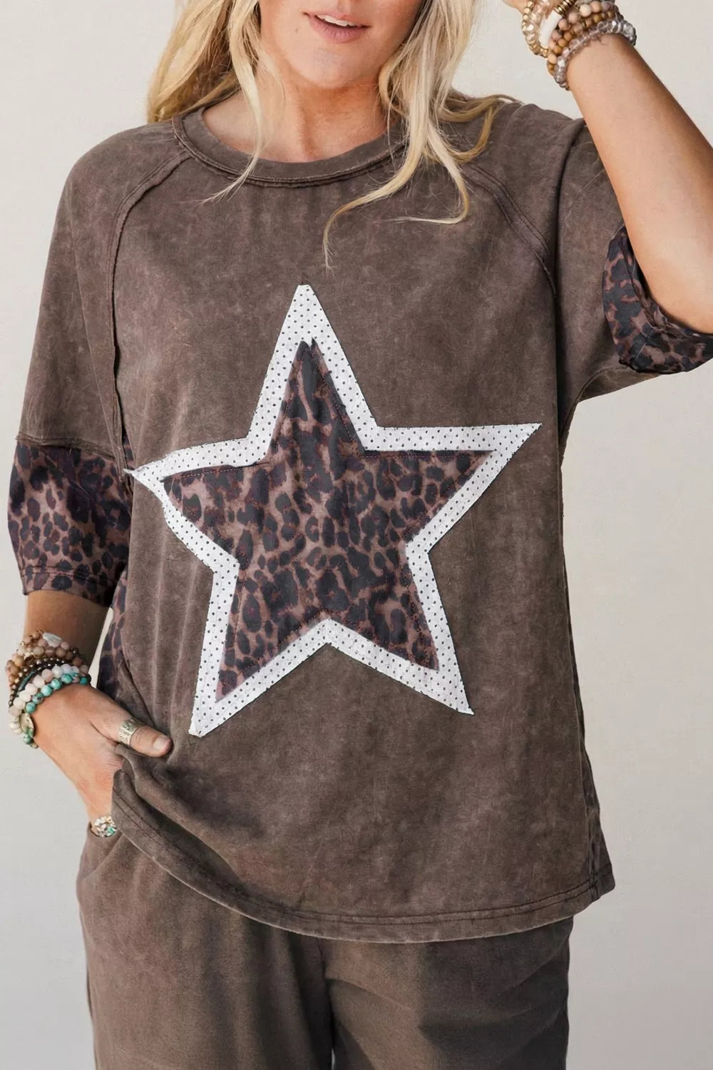 Brown mineral wash sweatshirt with leopard star applique and contrast sleeves.
