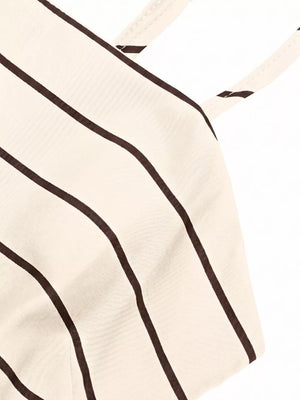 Apricot striped maternity swim dress with smocked detail and cutout.