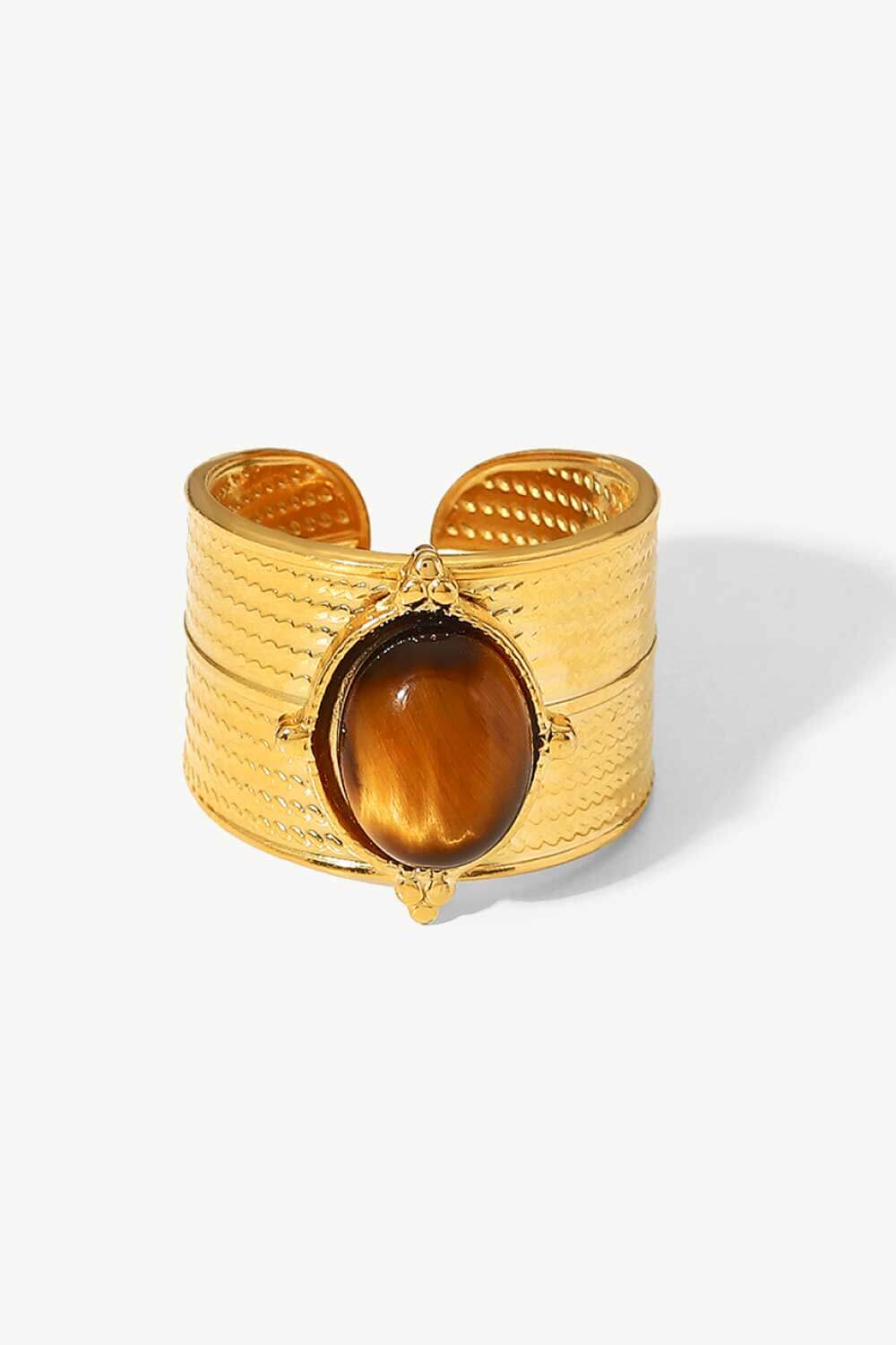 Textured tiger's eye cuff ring in gold with brown stone and boho design.