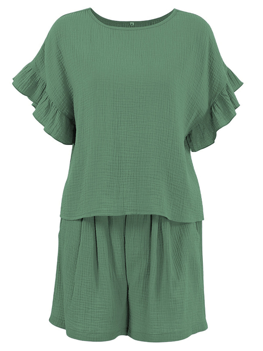 Textured gauze co-ord set in dark green with ruffle sleeves and gathered shorts.