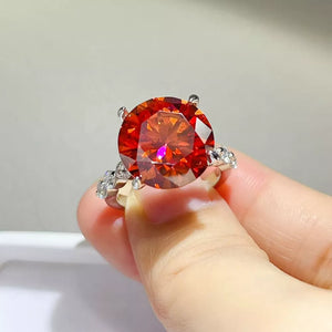 ring in orange-red featuring large center stone and fitted fit