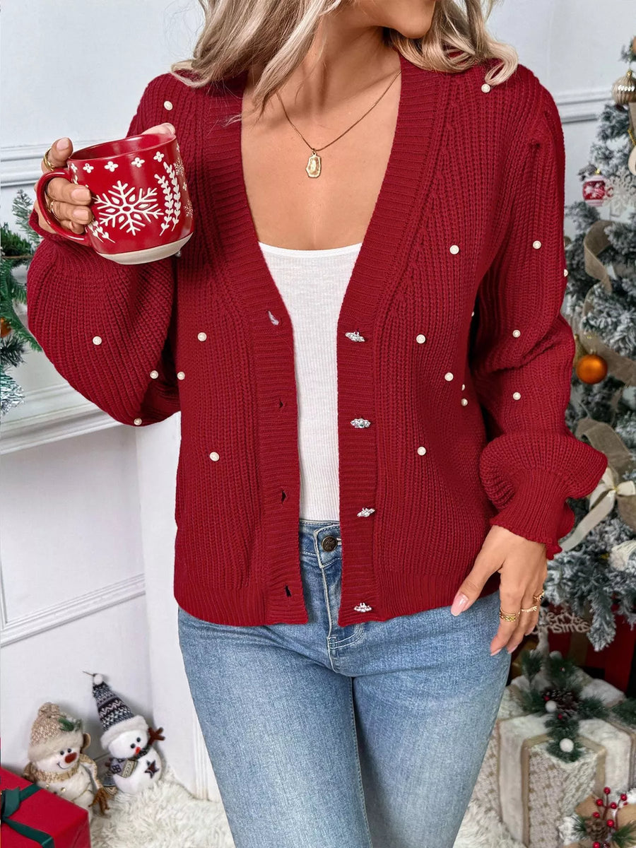 Red acrylic knit cardigan with pearl embellishments and button up front.