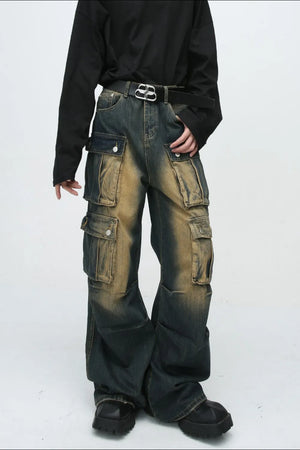Faded wash dark denim oversized cargo jeans with multiple button flap pockets.