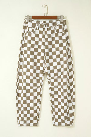Chic checkered denim barrel pants in brown and white cotton, featuring a relaxed fit and knee patch details.
