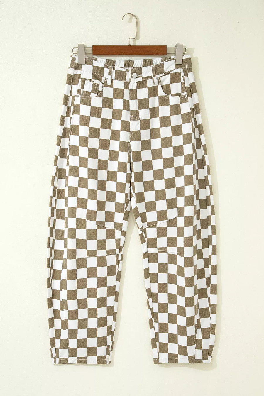 Chic checkered denim barrel pants in brown and white cotton, featuring a relaxed fit and knee patch details.