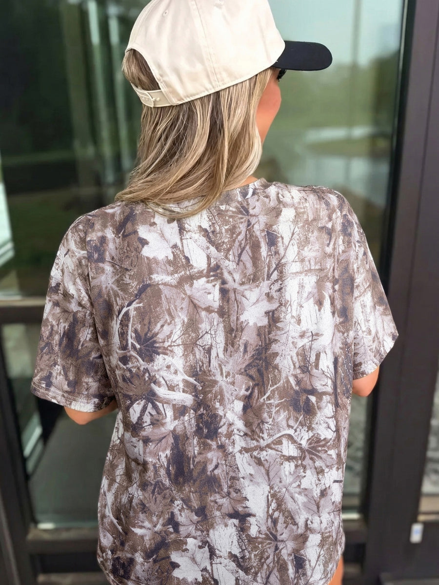 Woodland camouflage tunic with crew neck and short sleeves, featuring a drop shoulder cut.