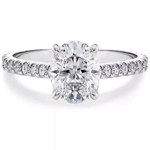 Elegant moissanite oval ring in sterling silver with pave band