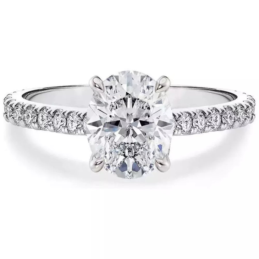 Elegant moissanite oval ring in sterling silver with pave band