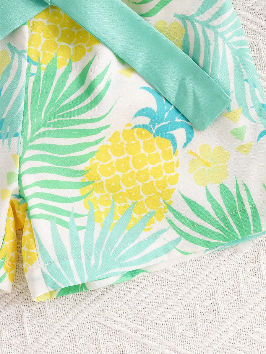 Baby girl's cotton shorts with pineapple print and teal trim.