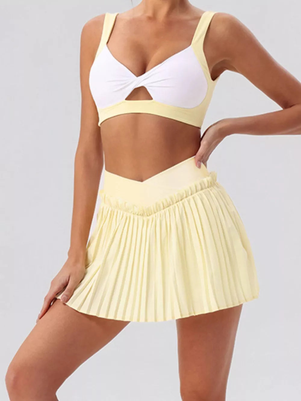 80% Nylon, 20% Spandex Care instructions: Machine wash cold activewear in Pastel Yellow with fitted silhouette