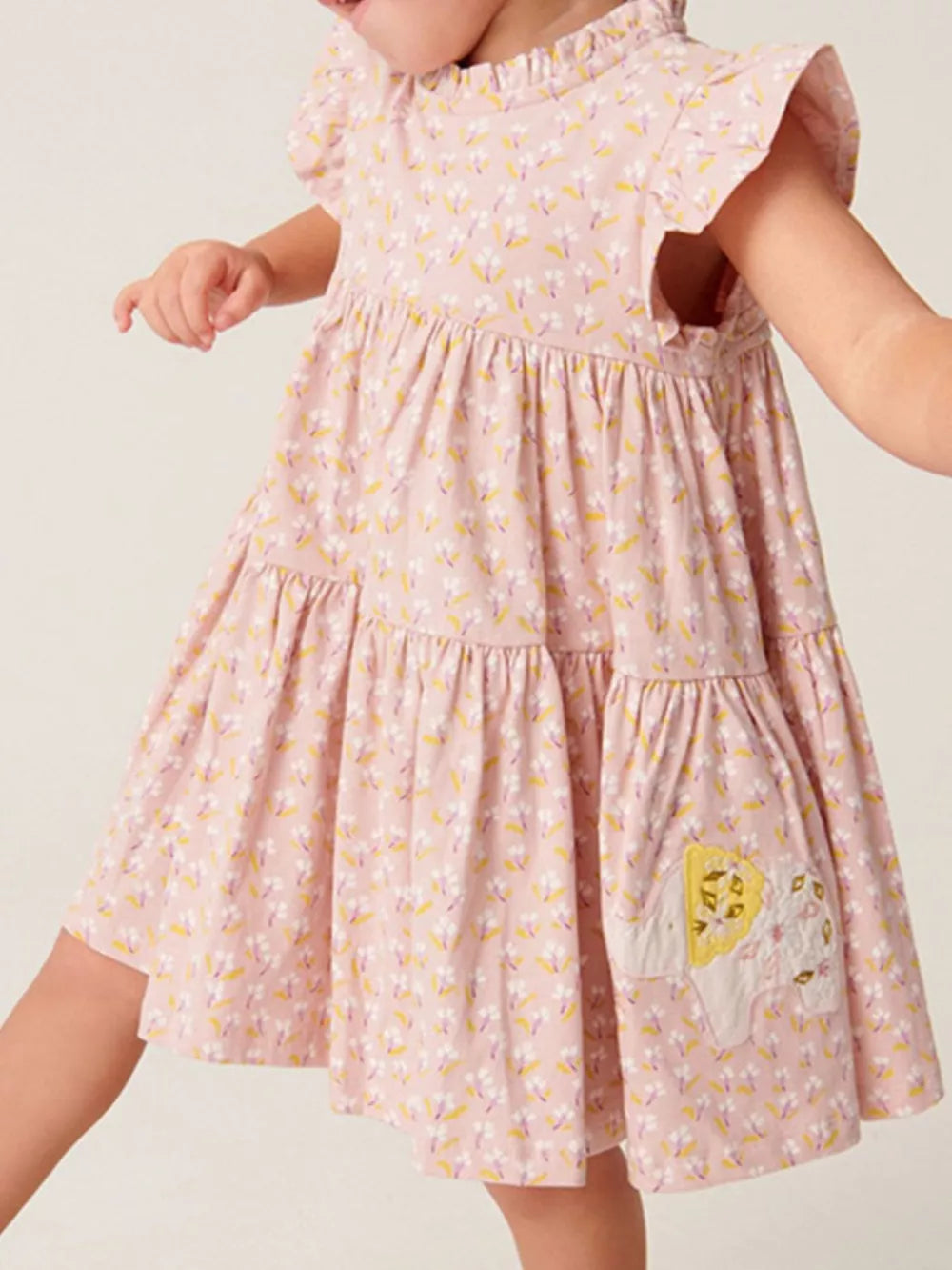 Toddler pink floral ruffle sleeve dress with tiered skirt and elephant applique.