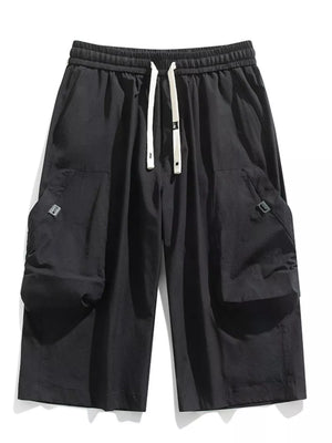 Black cargo capris with adjustable drawstring and large side pockets.